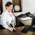 Female receptionist working at the front desk